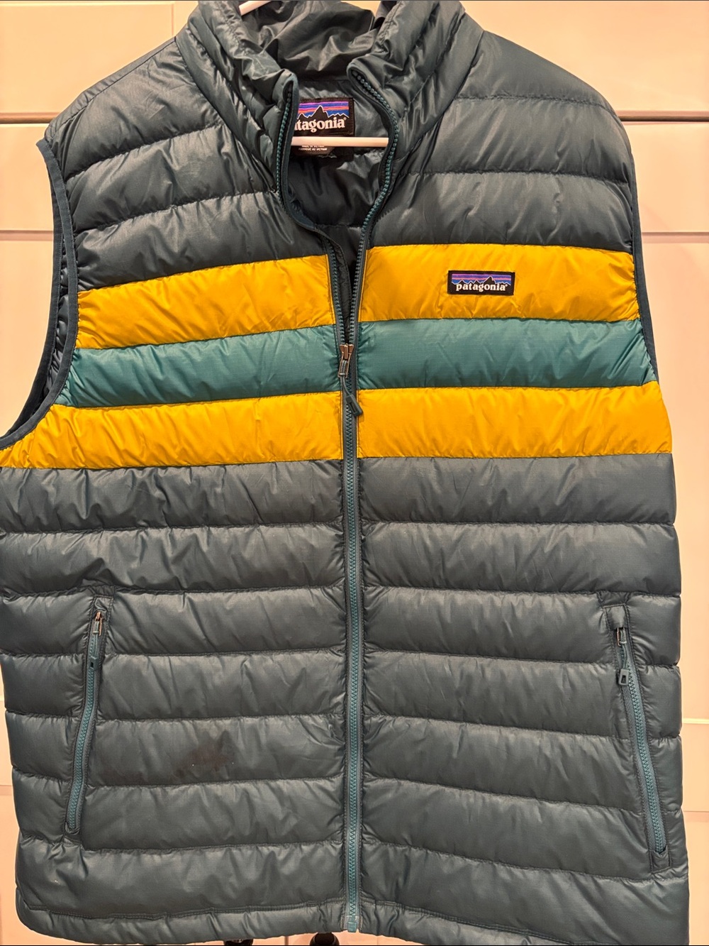 Patagonia Blue Vest with Yellow & Teal Chest Stripes